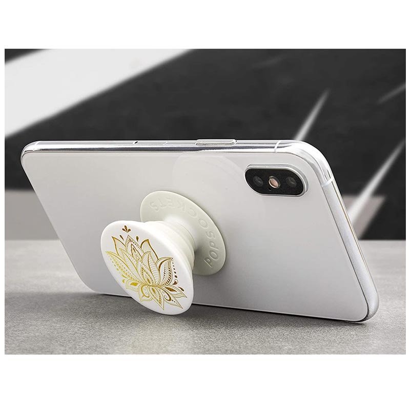 Mobilen och popsocket med lotusblomma i guld